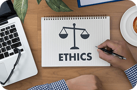 Ethics concept with tablet showing scales of justice