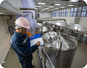 Food scientist in lab coat working with AI-powered food development tools