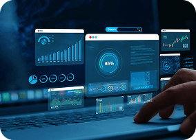 Hands typing on laptop with digital ERP interface and data visualizations