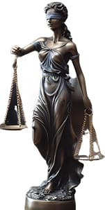 Lady Justice statue representing legal compliance and risk management