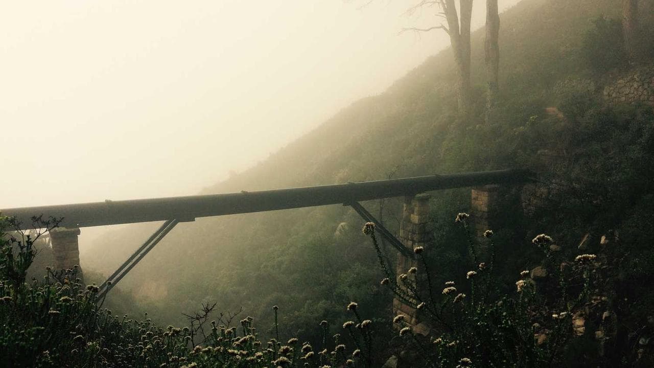 Modern construction site with digital overlay showing AI-powered project monitoring