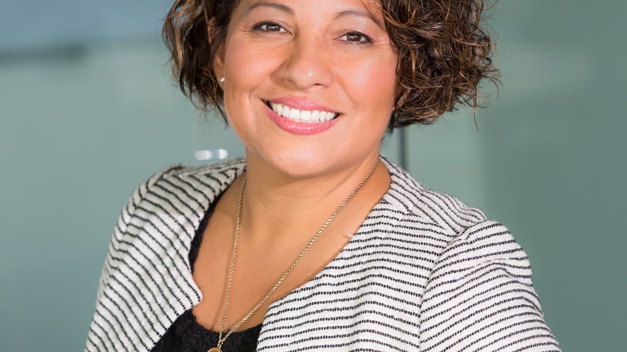 HR professional reviewing AI hiring bias audit checklist on digital display