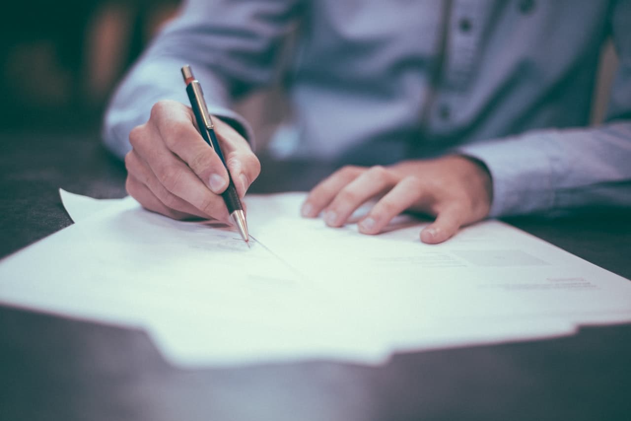 Professional reviewing regulatory compliance documentation for process manufacturing ERP system audit readiness