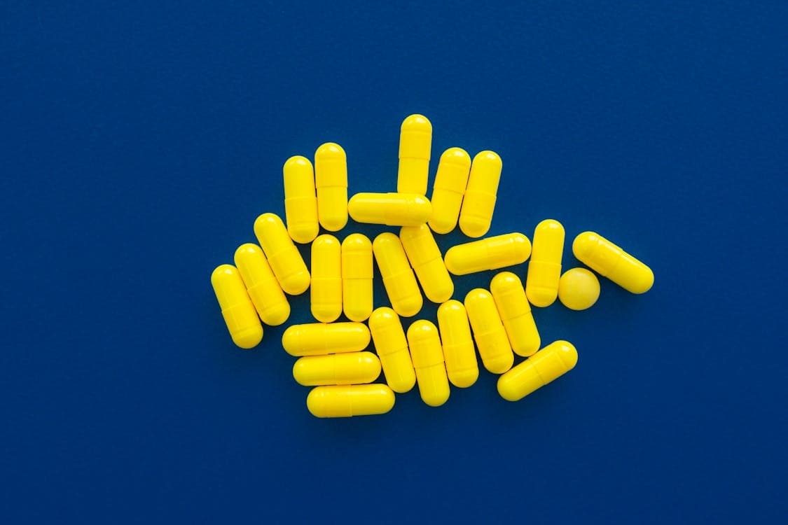 Nutraceutical supplement manufacturing with yellow capsules