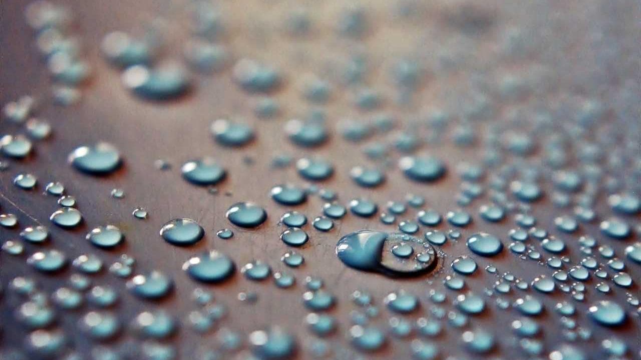 Real estate agent using AI property matching on tablet with happy clients