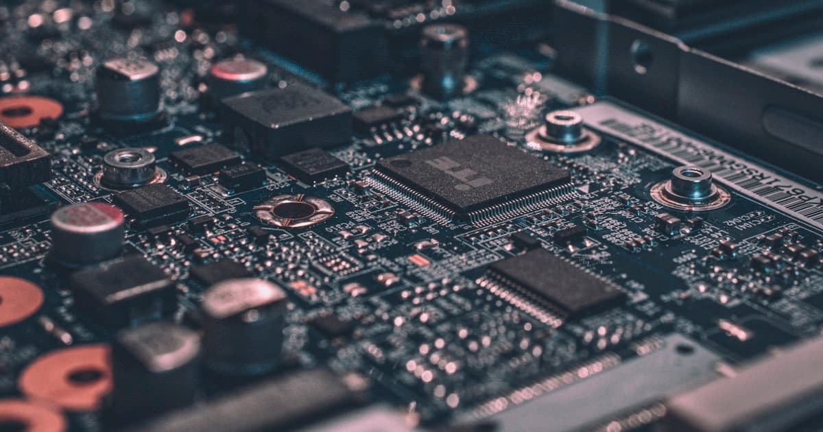 Close-up of a circuit board and microchip representing AI-powered ERP infrastructure